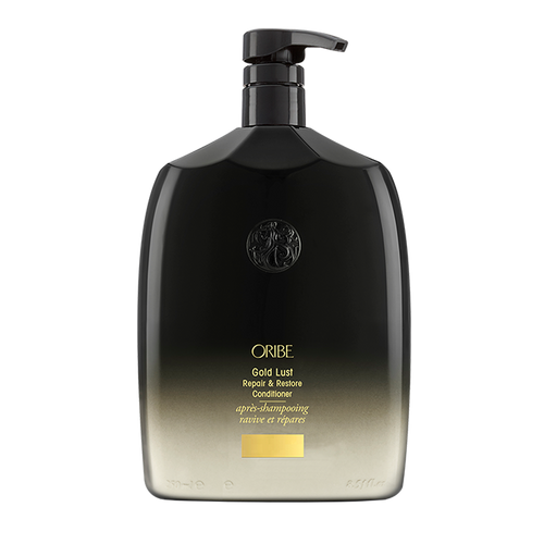 ORIBE - GOLD LUST Shampoo liter sized rounded bottle with black to cream ombre and gold lettering. Black pump top