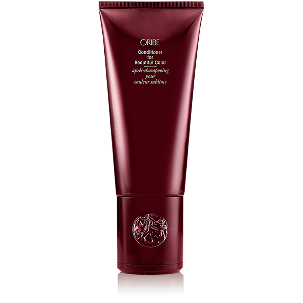 Oribe - Conditioner for Beautiful Color red bottle with flip top cap on bottom