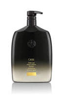 Load image into Gallery viewer, Oribe Gold Lust Shampoo Liter size rounded bottle. Black to gold ombre with black pump top.
