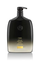 Load image into Gallery viewer, Oribe Gold Lust Shampoo Liter size rounded bottle. Black to gold ombre with black pump top.