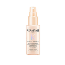 Load image into Gallery viewer, Travel size Kérastase Gloss Absolu Anti-Frizz Glaze Milk 45ml bottle on a white background, compact format designed for portability, delivering frizz control, heat protection, and glossy smooth finish on the go.
