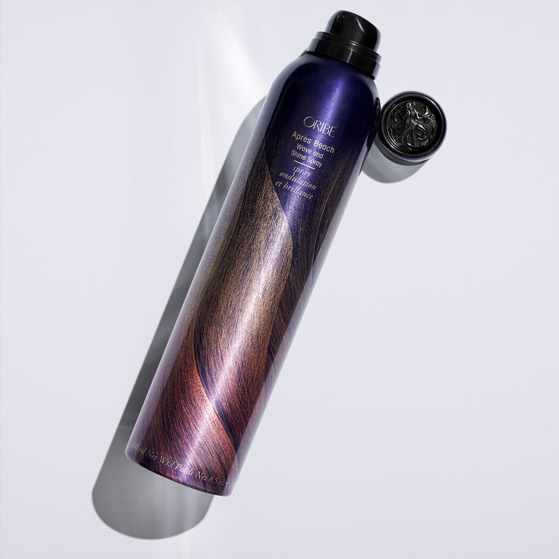 Oribe Après Beach Wave and Shine Spray bottle with cap removed on a white background