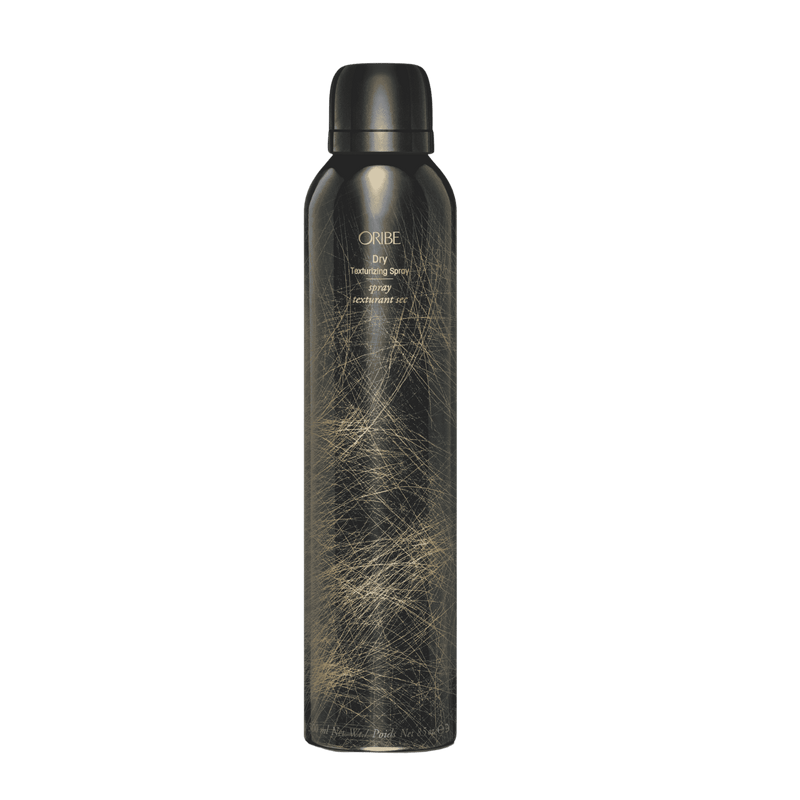 Oribe Dry Texturizing Spray standard 8.5 oz black aerosol can with fine gold linework, shown capped and upright from the front