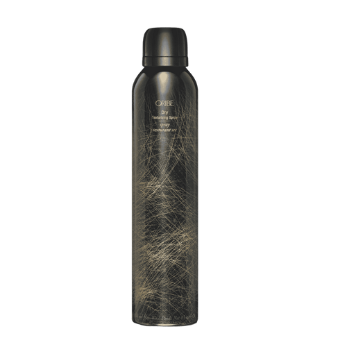 Oribe Dry Texturizing Spray standard 8.5 oz black aerosol can with fine gold linework, shown capped and upright from the front