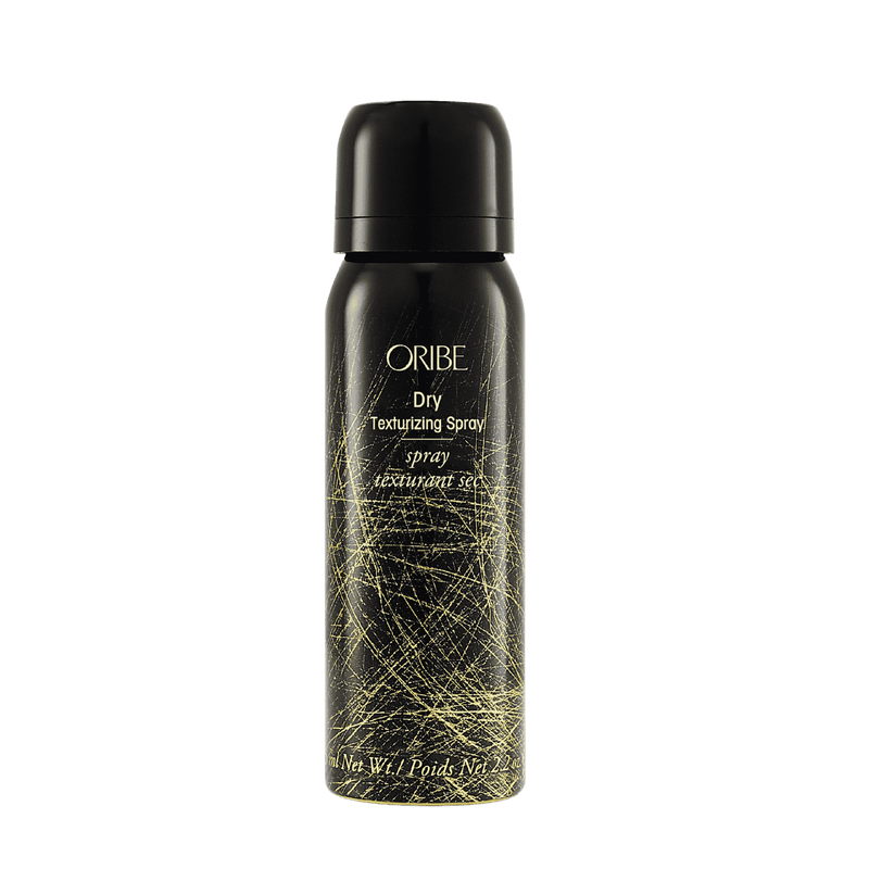Oribe Dry Texturizing Spray travel 2.1 oz black aerosol can with fine gold linework, shown capped and upright from the front
