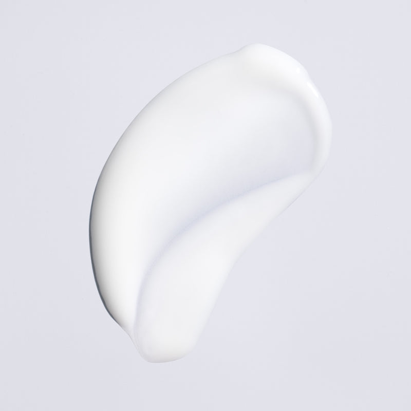 Lightweight cream texture of Oribe Featherbalm Weightless Styler