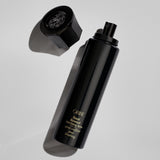 Oribe Royal Blowout Heat Styling Spray bottle with spray nozzle and cap removed