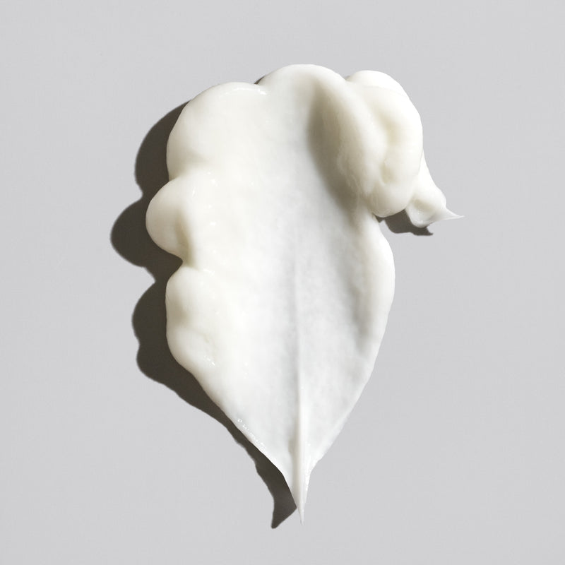 Rich white cream texture of Oribe Signature Conditioner