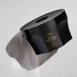 Oribe Signature Moisture Masque jar photographed with sculptural shadows