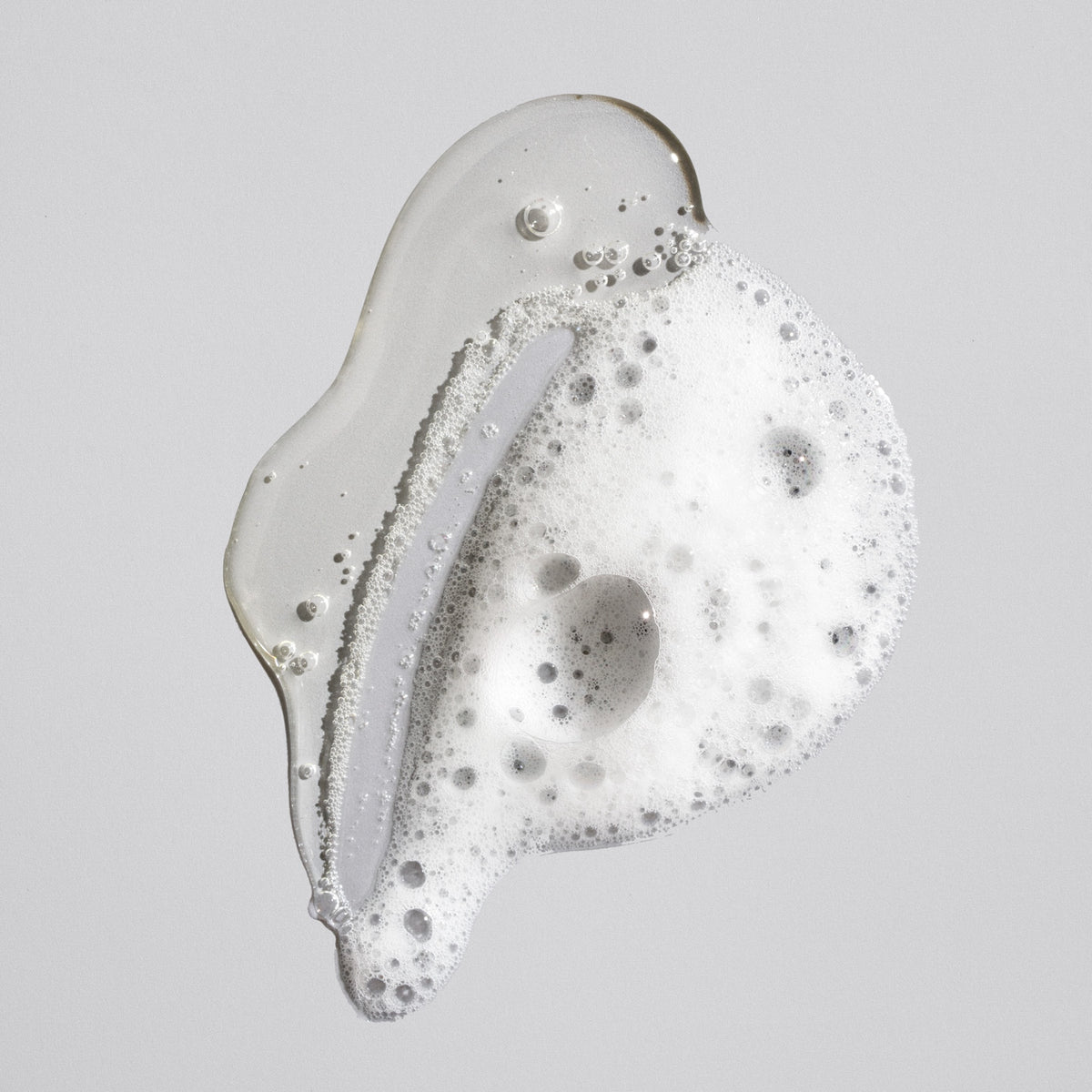 Clear gel and foaming texture of Oribe Signature Shampoo