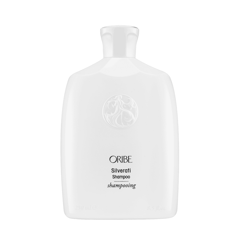 Oribe Silverati Shampoo 8.5 oz in its sculpted white bottle with embossed crest, shown upright from the front on white