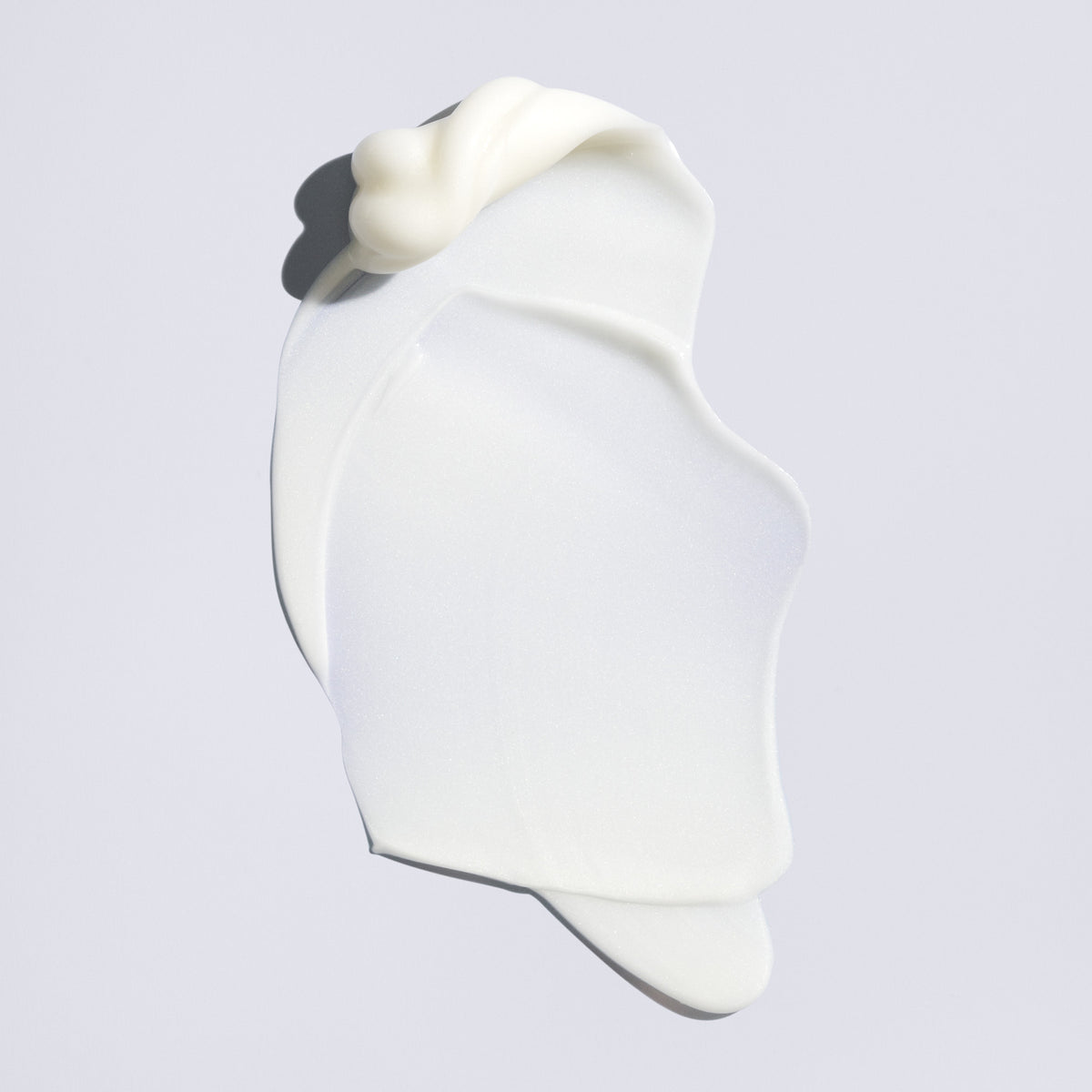 Lightweight white texture of Oribe Supershine Light Moisturizing Cream