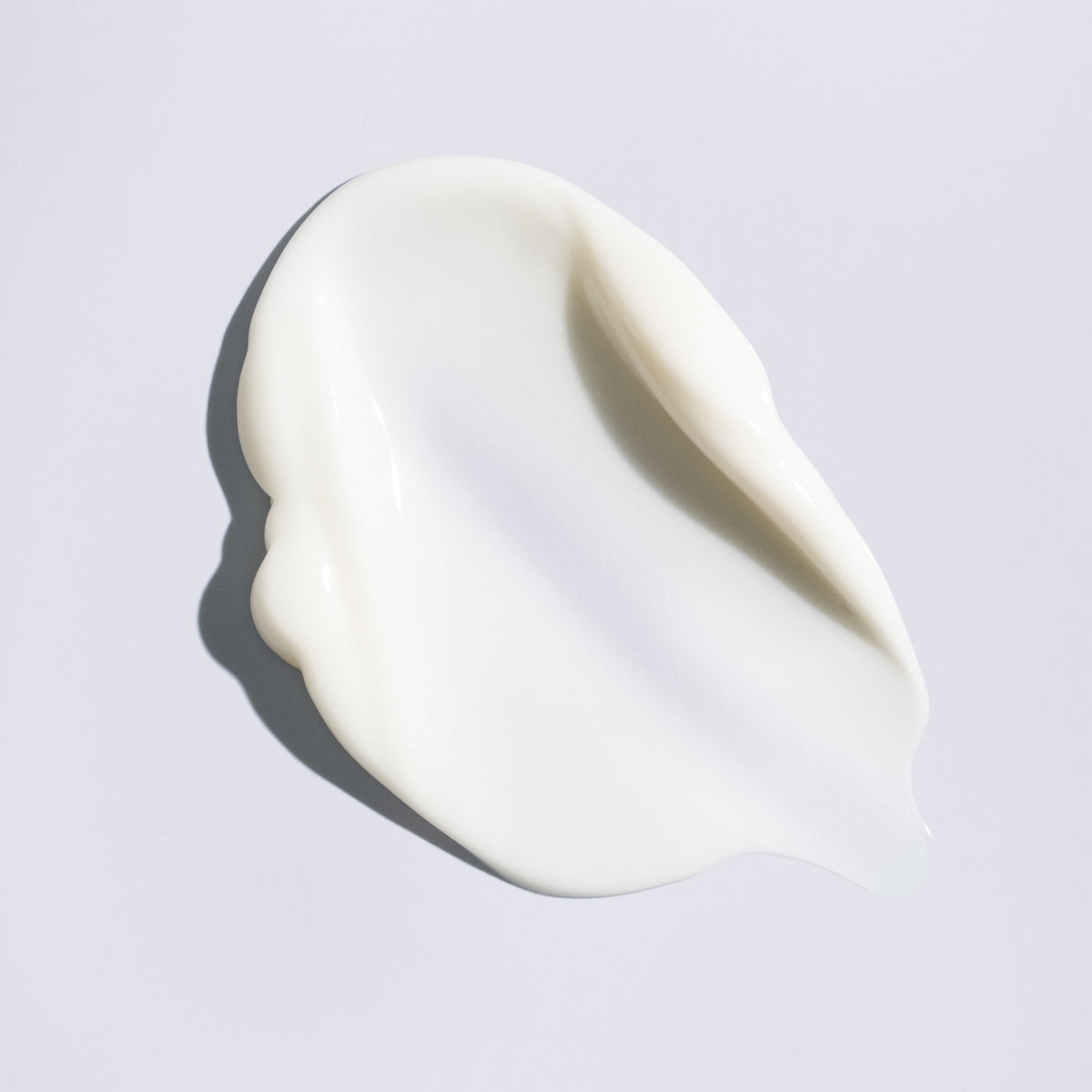 Silky white texture of Oribe Supershine Moisturizing Cream leave in conditioner