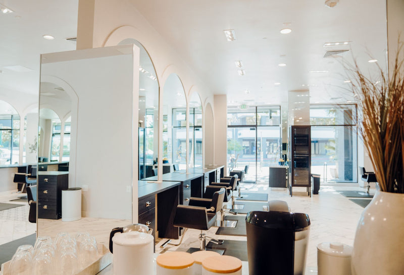 Bright interior of The/Studio hair salon in Walnut Creek with modern styling stations and luxury salon design.