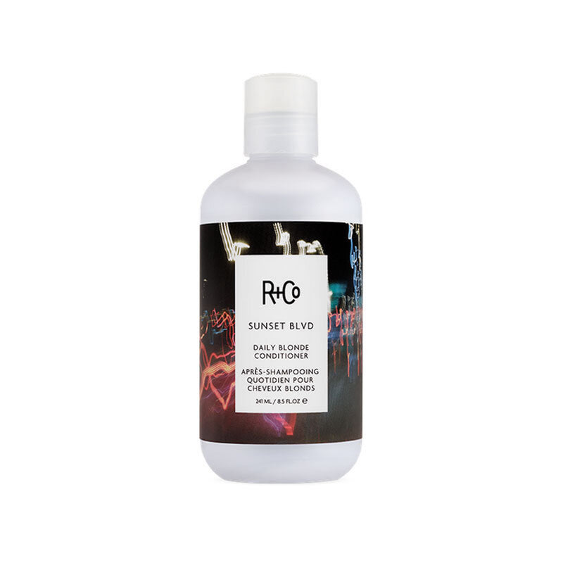 R+Co - SUNSET BLVD Conditioner 8.5 oz. bottle with blurry lights background graphic