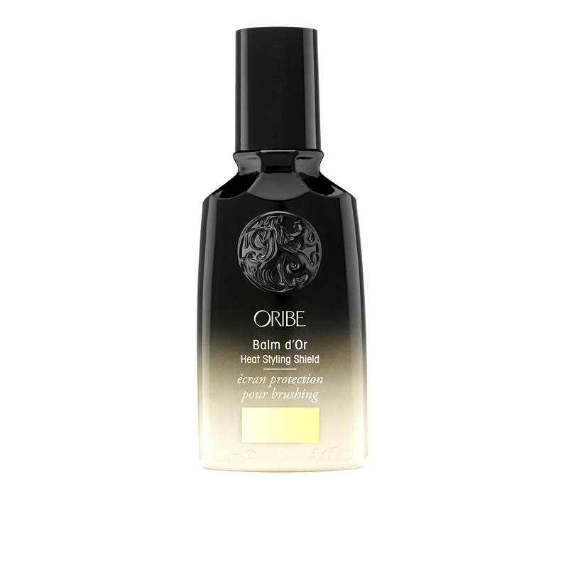Oribe - Balm d'Or black and gold ombre bottle with black lid