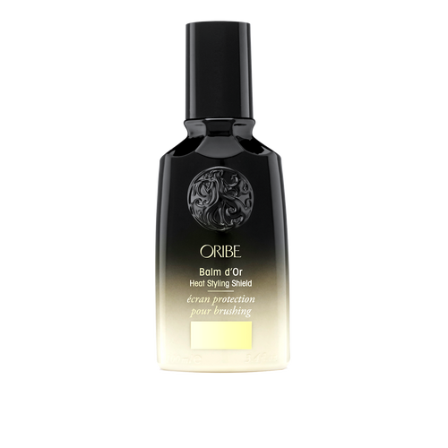 Oribe - Balm d'Or black and gold ombre bottle with black lid