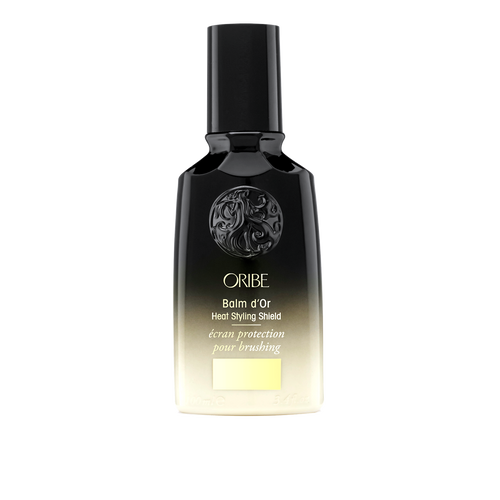 Oribe Balm d’Or Heat Styling Shield for heat styled hair.