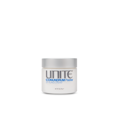 Unite - CONUNDRUM Paste circular container white 2 0z. with silver twist top lid.