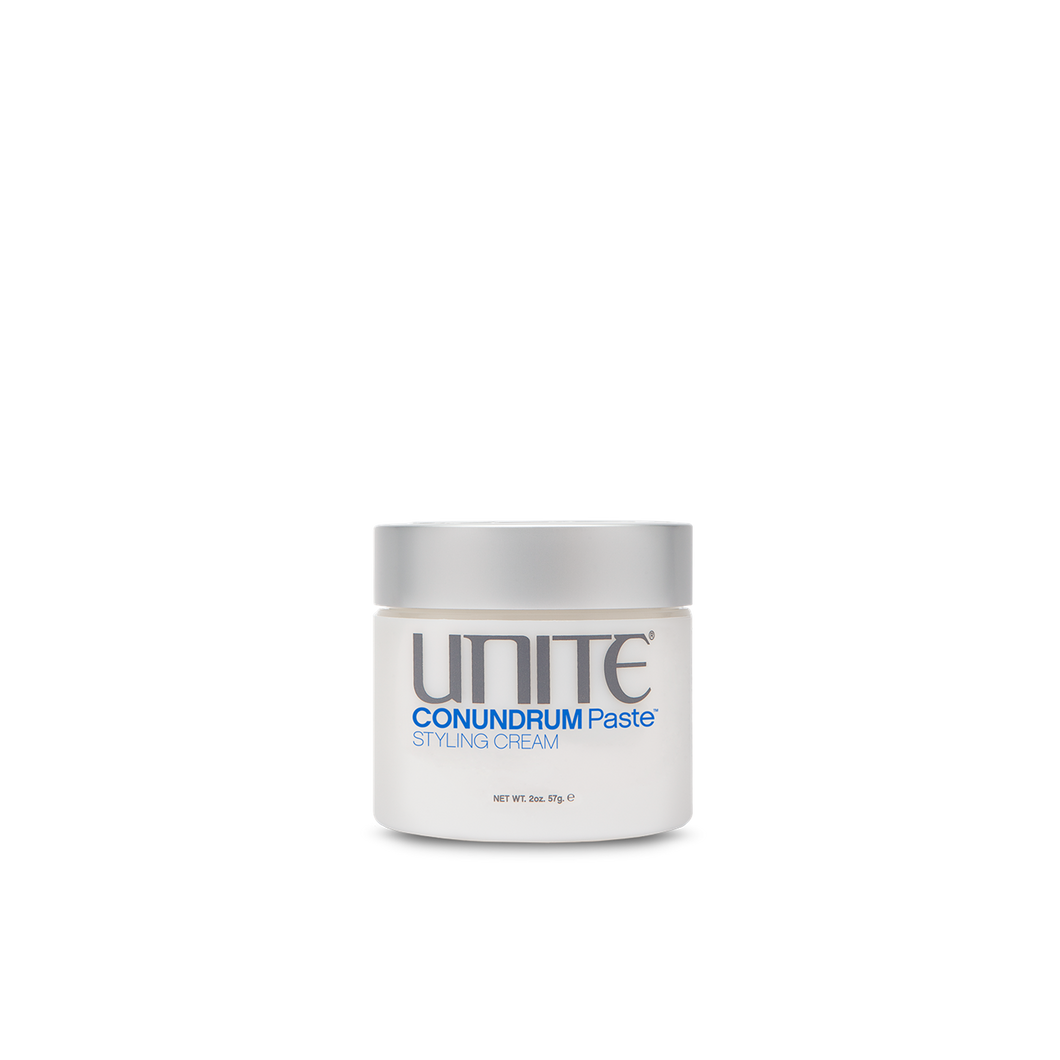 Unite - CONUNDRUM Paste circular container white 2 0z. with silver twist top lid.