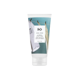 R+Co - COOL WIND creme bottle with flip top cap on bottom and air drying laundry graphics