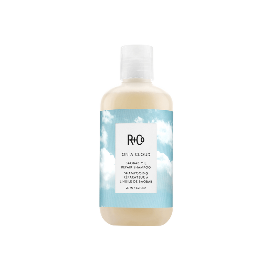 R+Co - ON A CLOUD Shampoo bottle with blue sky and cloud background graphics