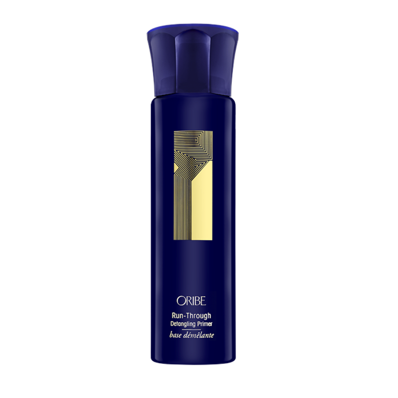 Oribe - Run through blue non aerosol spray bottle with gold accents and writing.