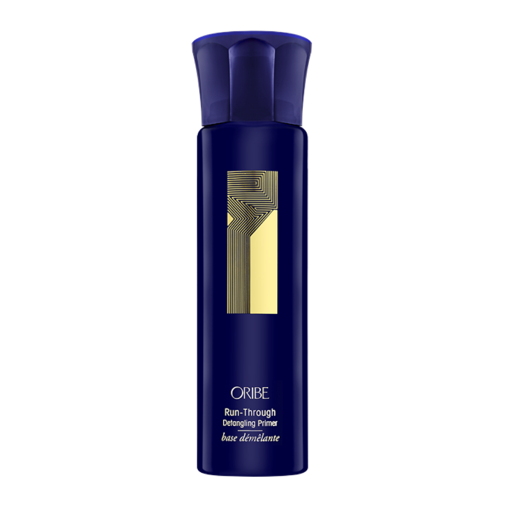 Oribe - Run through blue non aerosol spray bottle with gold accents and writing.