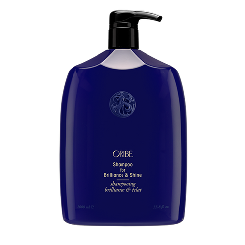 Oribe - Brilliance & Shine shampoo liter sized rounded blue bottle with black pump top