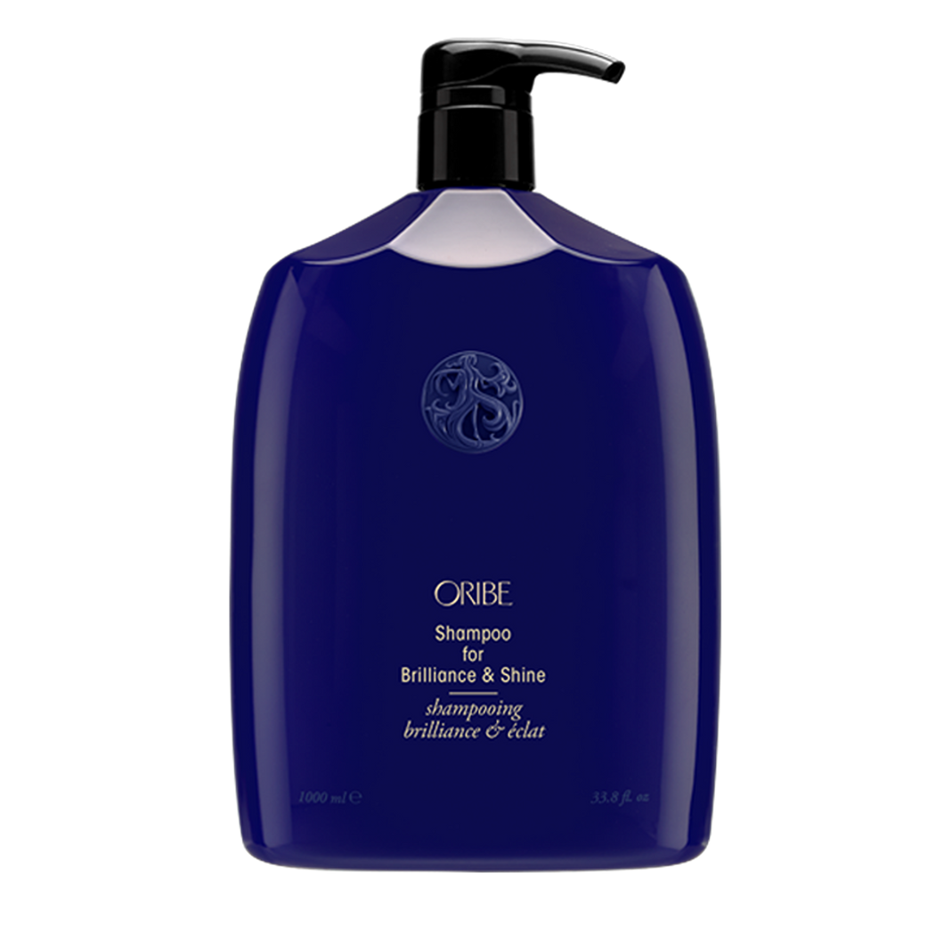 Oribe - Brilliance & Shine shampoo liter sized rounded blue bottle with black pump top