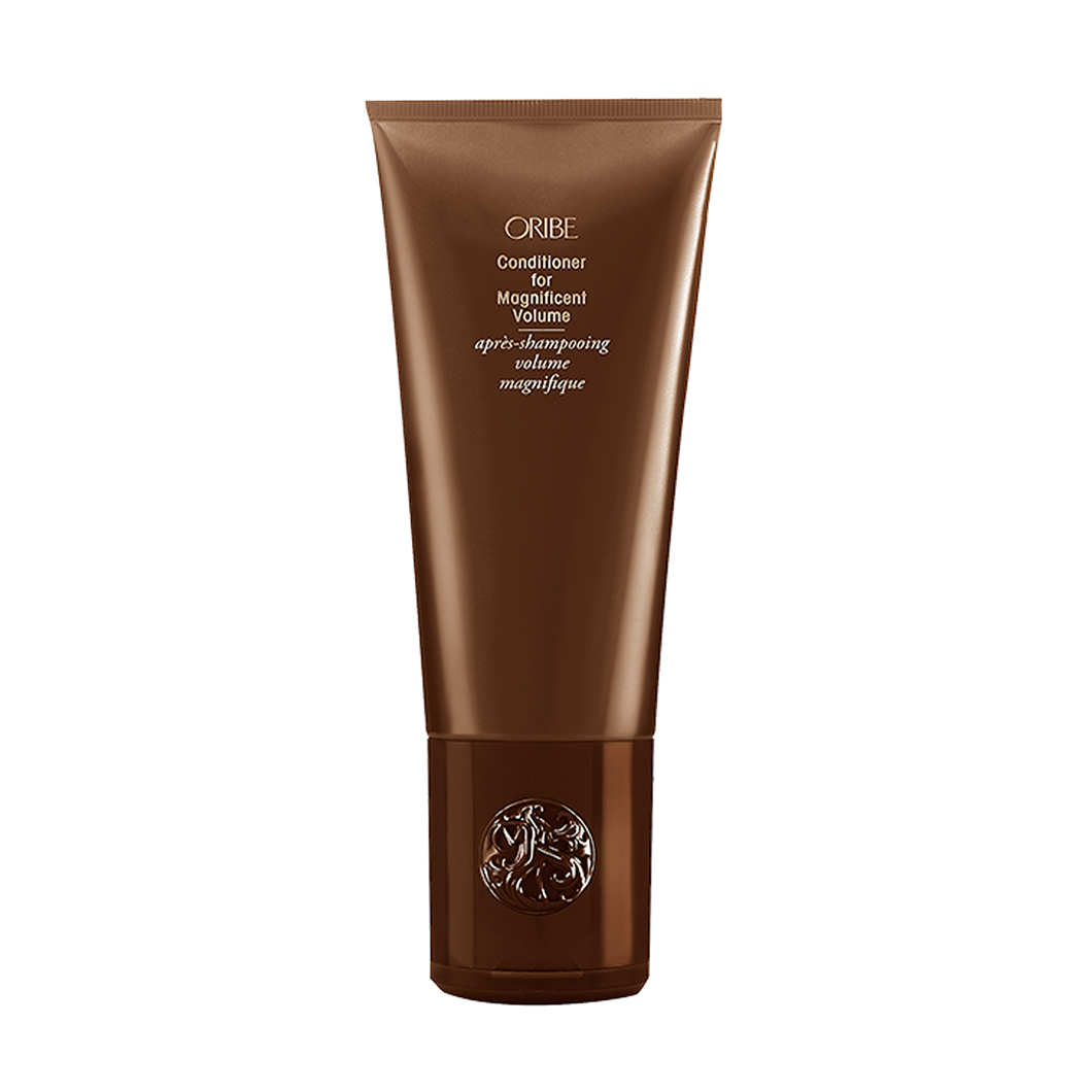 Oribe - Conditioner for Magnificent Volume Brown bottle with flip top cap on bottom