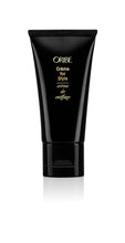 Load image into Gallery viewer, Oribe - Creme for Style black travel size bottle with flip top cap on bottom
