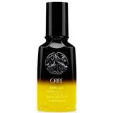 Oribe Gold Lust Nourishing Hair Oil for shine and frizz control — 1.7 oz travel size.