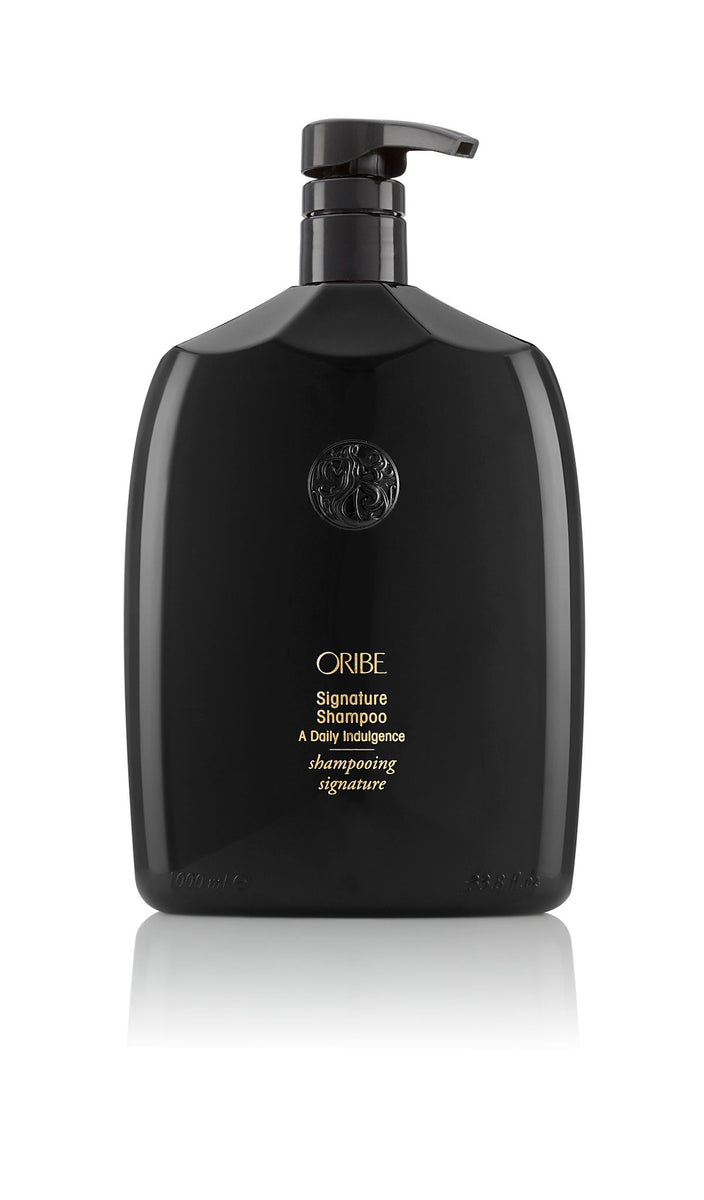 Oribe Signature Shampoo for all hair types — 2.5 oz travel size.