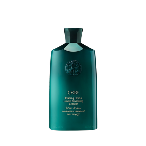 Oribe - Priming Lotion green bottle with gold writing