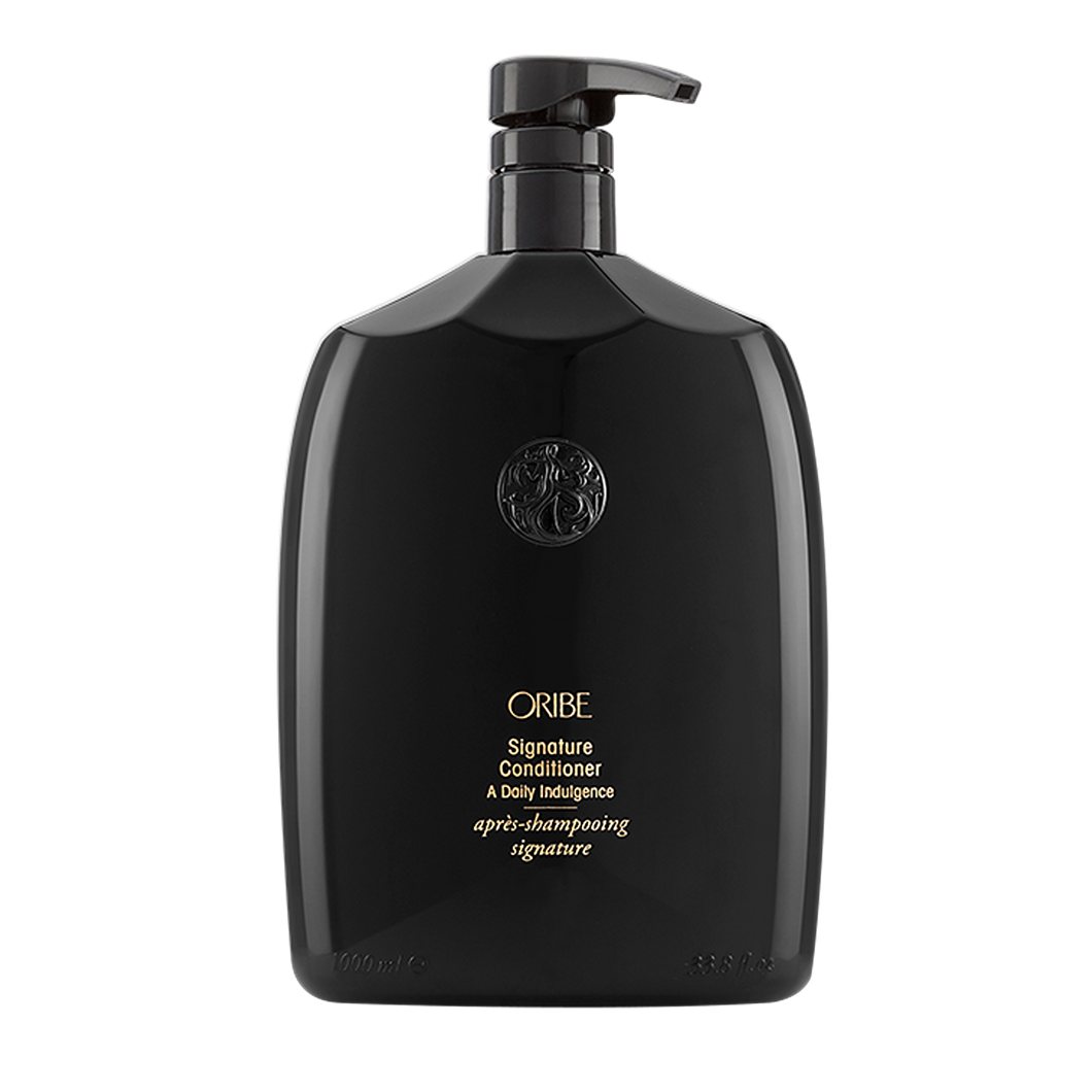 Oribe - SIGNATURE Conditioner liter sized bottle. All black with gold lettering and black pump top